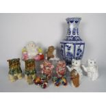 A collection of Oriental ceramics to include octagonal section blue and white vase (36 cm height),