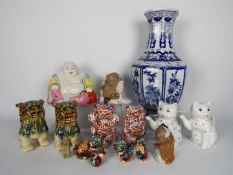A collection of Oriental ceramics to include octagonal section blue and white vase (36 cm height),