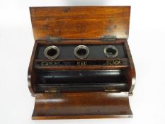 A wooden desk tidy / inkwell stand bearing badge of the 12th Royal Lancers.