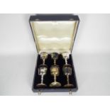 A cased set of six Irish silver goblets, each with knopped stem and silver gilt bowl interior,