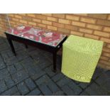 A double piano stool with lift up, upholstered seat on spade foot supports,