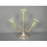 A Walker & Hall silver plated and vaseline glass epergne, having three glass flutes,