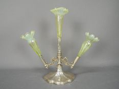 A Walker & Hall silver plated and vaseline glass epergne, having three glass flutes,