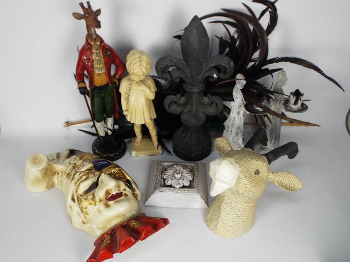 A collection of decorative items to include plaster model of a child, candle holders,