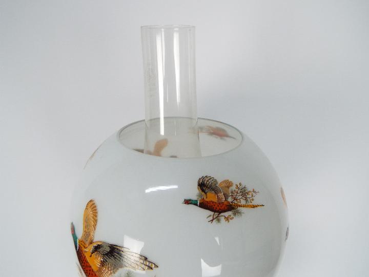 A brass oil lamp on circular base with four column supports, the shade decorated with game birds, - Image 7 of 11