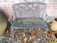 Gardenware - a white painted metal garden seat, the back with rose decoration,