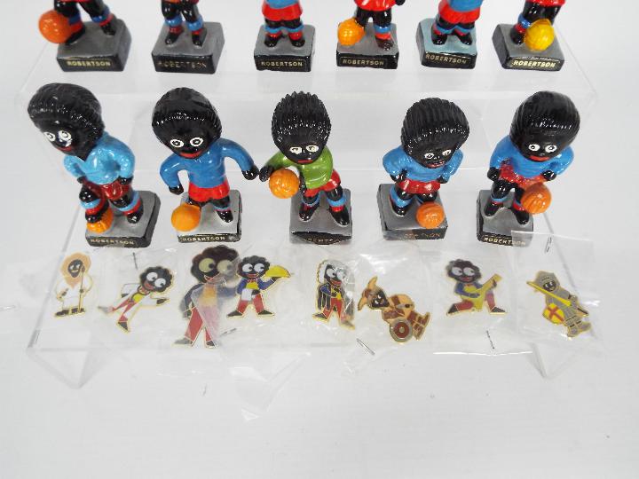 A quantity of Robertsons Golly figurines, footballers and seven enamel badges to include viking, - Image 3 of 4