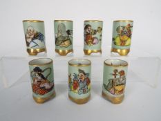 A set of seven miniature vases depicting the Happy Gods, each approximately 5 cm.