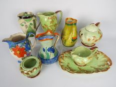 A collection of Art Deco ceramics to include a Myott pinch neck jug.