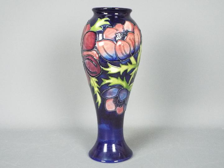 Moorcroft - A Moorcroft Pottery vase of inverted baluster form decorated with anemone against a
