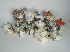 A collection of teapots, predominantly Sadlers.