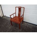A vintage Chinese hardwood chair with Shou roundel to the backrest.