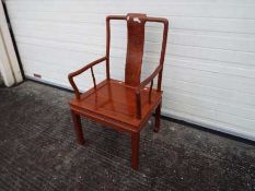 A vintage Chinese hardwood chair with Shou roundel to the backrest.