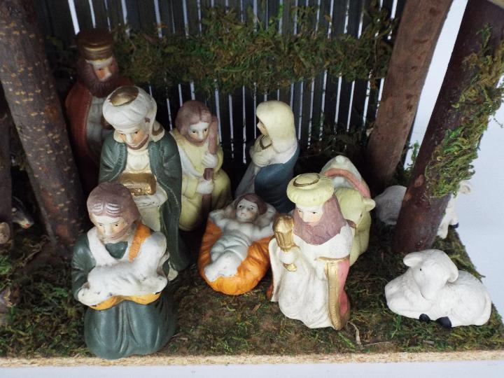 A Christmas Nativity diorama with ceramic figures, - Image 2 of 4