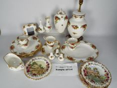 A large quantity of Royal Albert Old Country Roses dinner and tea wares to include plates, cups,