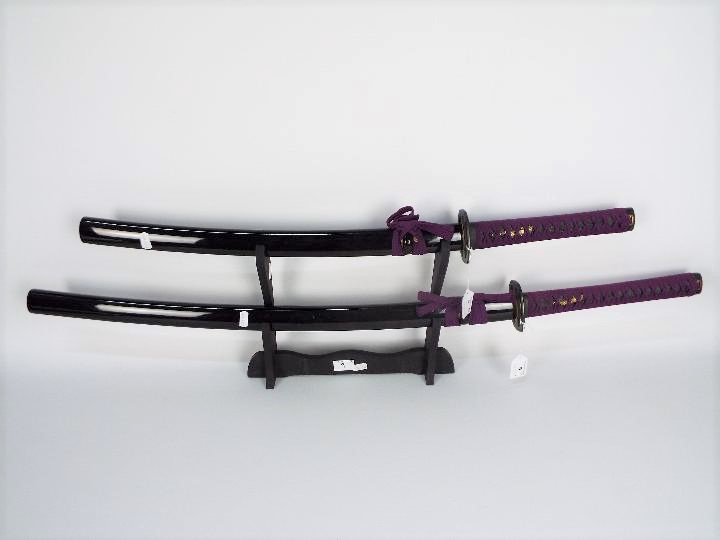 A pair of good quality reproduction Samurai swords comprising katana and wakizashi,