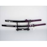 A pair of good quality reproduction Samurai swords comprising katana and wakizashi,