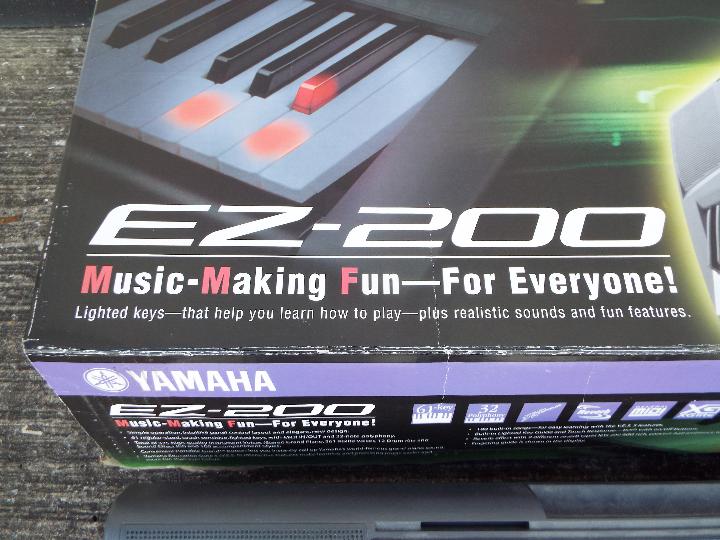 A boxed Yamaha EZ-200 electronic keyboard. - Image 3 of 3