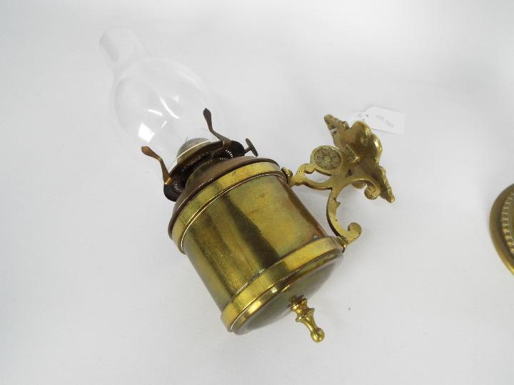 Two brass oil lamps, one with wall mount, largest approximately 40 cm (h) including chimney. - Image 2 of 5