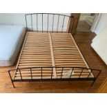 A metal framed double bed.