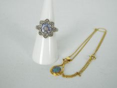 A silver 'Flowerhead' ring, stamped 925 and yellow metal and opal pendant and chain.