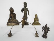A small collection of bronze and brass religious figures,