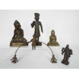 A small collection of bronze and brass religious figures,