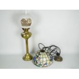 A brass column oil lamp with white shade,