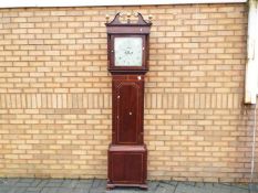 A late 18th/ early 19th century 8-day longcase clock signed to the 13 inch square painted dial for