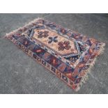 A rug measuring approximately 192 cm x 125 cm