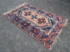 A rug measuring approximately 192 cm x 125 cm