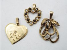 Two 9ct gold stone set, Heart pendants and one further, unmarked yellow metal, stone set pendant,