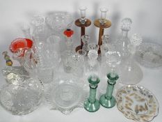 Mixed glassware to include decanters, bowls, knife rests, candlesticks and similar.