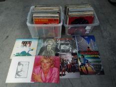 Two boxes of 12" vinyl records to include Status Quo, Rod Stewart, Cat Stevens, 10cc, Sad Cafe,