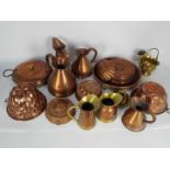 A collection of antique and vintage metalware, copper, brass to include measuring jugs,