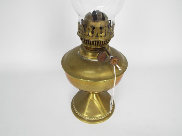 Two brass oil lamps, one with wall mount, largest approximately 40 cm (h) including chimney. - Image 5 of 5