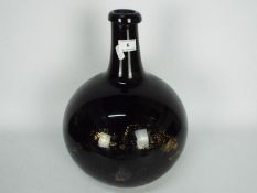 A 19th century, amethyst glass, apothecary carboy / demijohn of bulbous form,