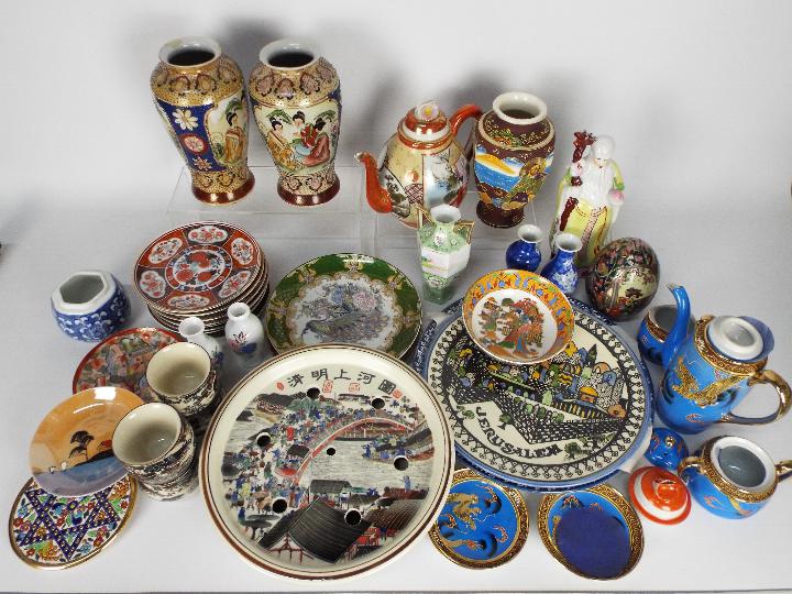 A mixed lot of Oriental ceramics to include vases, tea wares, plates and similar.