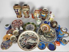 A mixed lot of Oriental ceramics to include vases, tea wares, plates and similar.