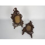 A pair of cast iron, rococo style photograph / picture frames, each approximately 35 cm (h).