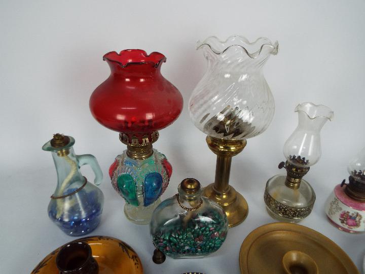 A collection of oil lamps, candle stands, chambersticks, largest approximately 28 cm (h). - Image 2 of 5