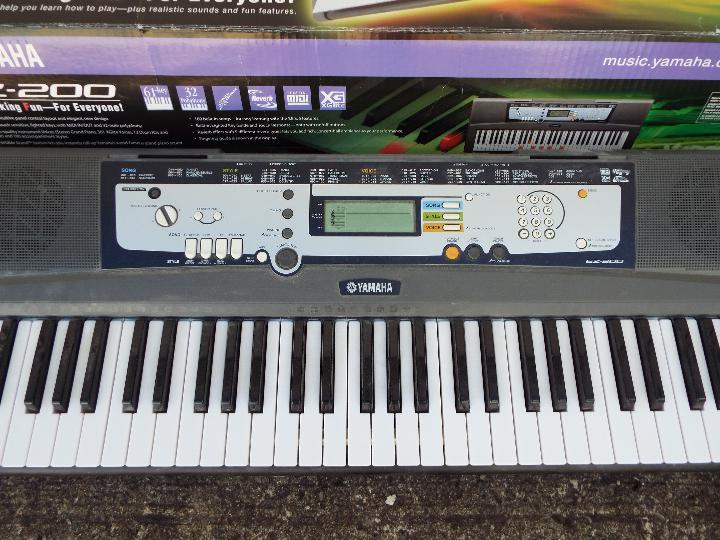 A boxed Yamaha EZ-200 electronic keyboard. - Image 2 of 3