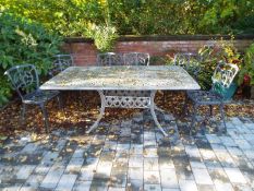 Gardenware - a white painted metal garden set comprising rectangular table and six chairs,