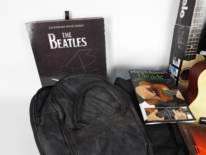 A quantity of vintage sheet music, two guitar carry cases and a boxed ukulele. - Image 3 of 4