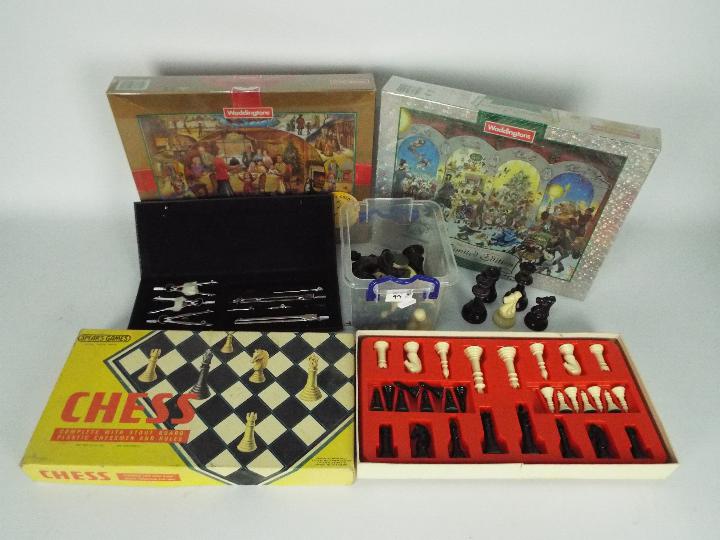 Lot to include factory sealed jigsaw puzzles, a boxed Spears chess set,