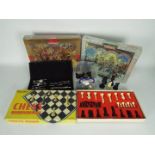 Lot to include factory sealed jigsaw puzzles, a boxed Spears chess set,