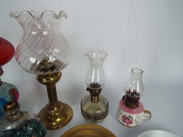 A collection of oil lamps, candle stands, chambersticks, largest approximately 28 cm (h). - Image 3 of 5