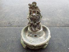 A reconstituted stone garden bird bath / water feature.