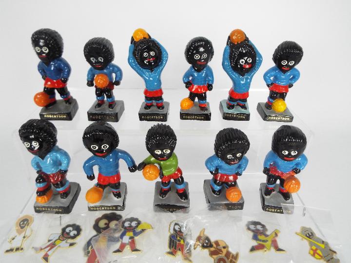 A quantity of Robertsons Golly figurines, footballers and seven enamel badges to include viking, - Image 2 of 4