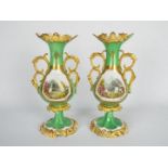 A pair of twin handled porcelain vases decorated with landscape garden panels to one side and